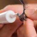What dissolves lash glue?